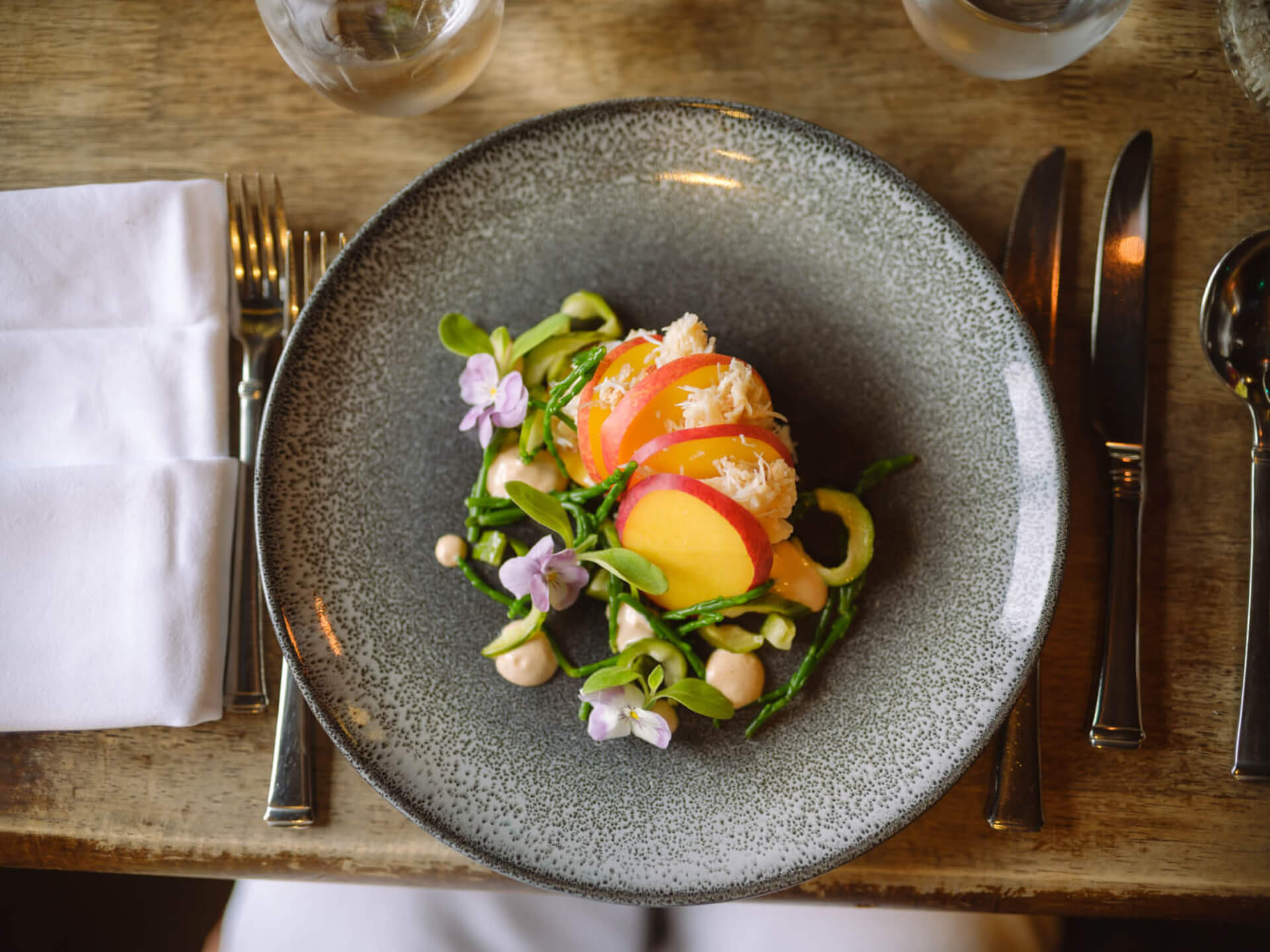 Food beautifully arranged on a plate from The Nettlefold Restaurant at Burgh Island