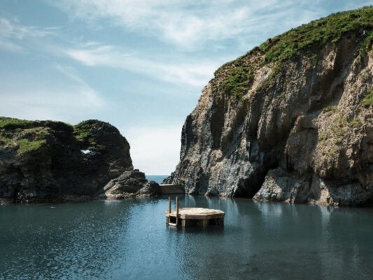 Mermaid pool in the sea surrounded by cliffs at Burgh Island