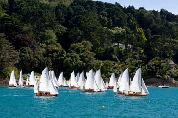 Yawl class sailboats racing in beautiful estuary. Salcombe, Devon, UK.