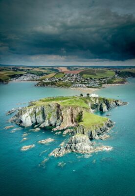 An aerial shot of Burgh Island with a dramatic sky