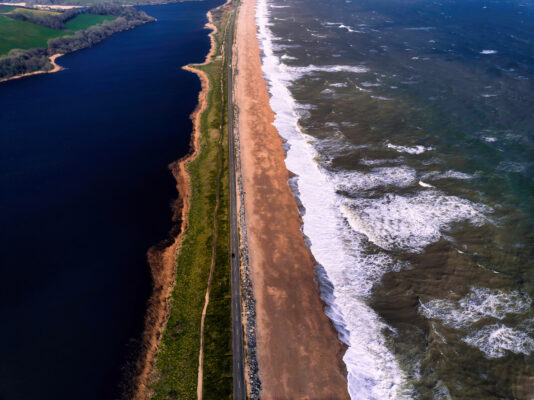 Aerial view of Torcross, Slapton Ley Nature Reserve, South Devon, England, UK using Mavic 3 drone