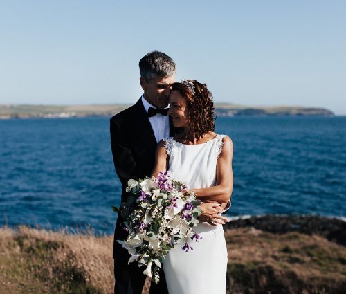 People hugging after a wedding at Burgh Island