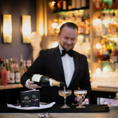 Burgh Island Member of Staff Pouring Wine for Two Guests