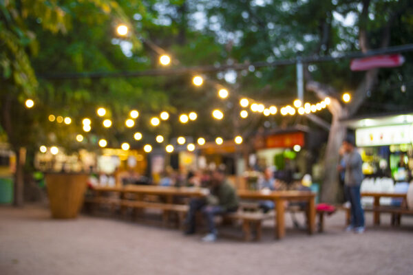 Blurred outdoor background.
